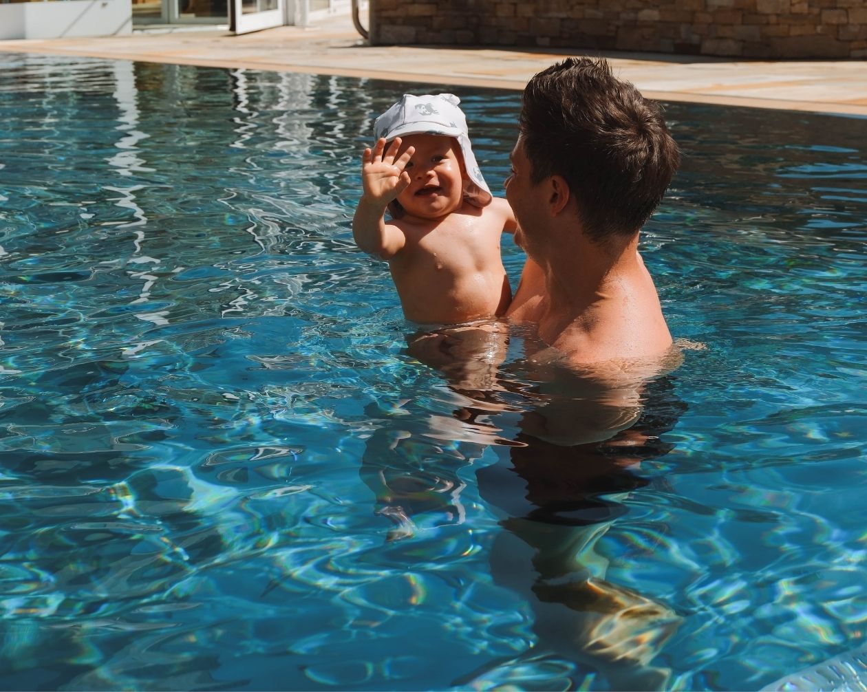 Laughing child in the pool